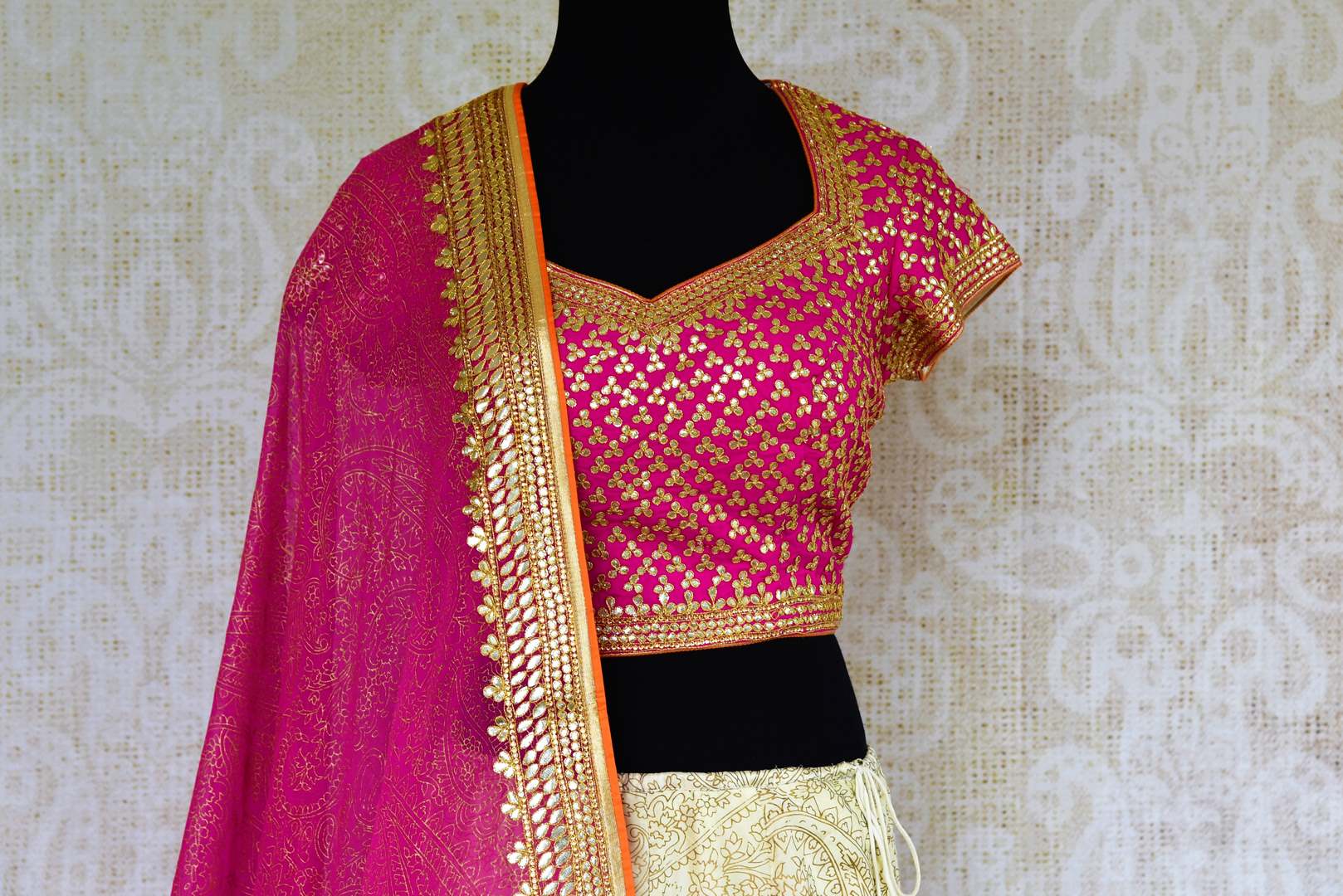Buy pink and cream embroidered lehenga choli online from Pure Elegance with dupatta. Our Indian fashion store brings stunning desginer wedding lehengas in USA.-choli front