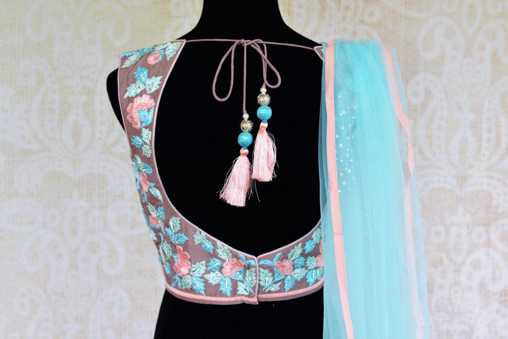 Buy pink and blue embroidered lehenga choli online from Pure Elegance with dupatta. Our fashion store brings stunning Indian designer lehenga choli in USA for women.-choli back