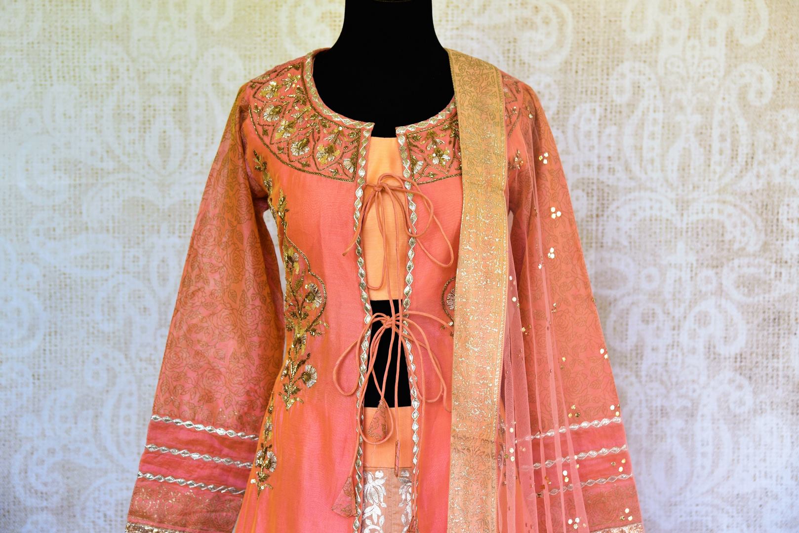 Buy peach gota patti kurta with chanderi silk skirt online in USA. Pure Elegance fashion store brings a stunning range of Indian formal dresses in USA for every occasion.-top
