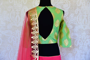 Buy pink and green applique silk lehenga with dupatta online in USA. Pure Elegance fashion store brings a stunning range of Indian wedding lehengas in USA for weddings.-blouse back