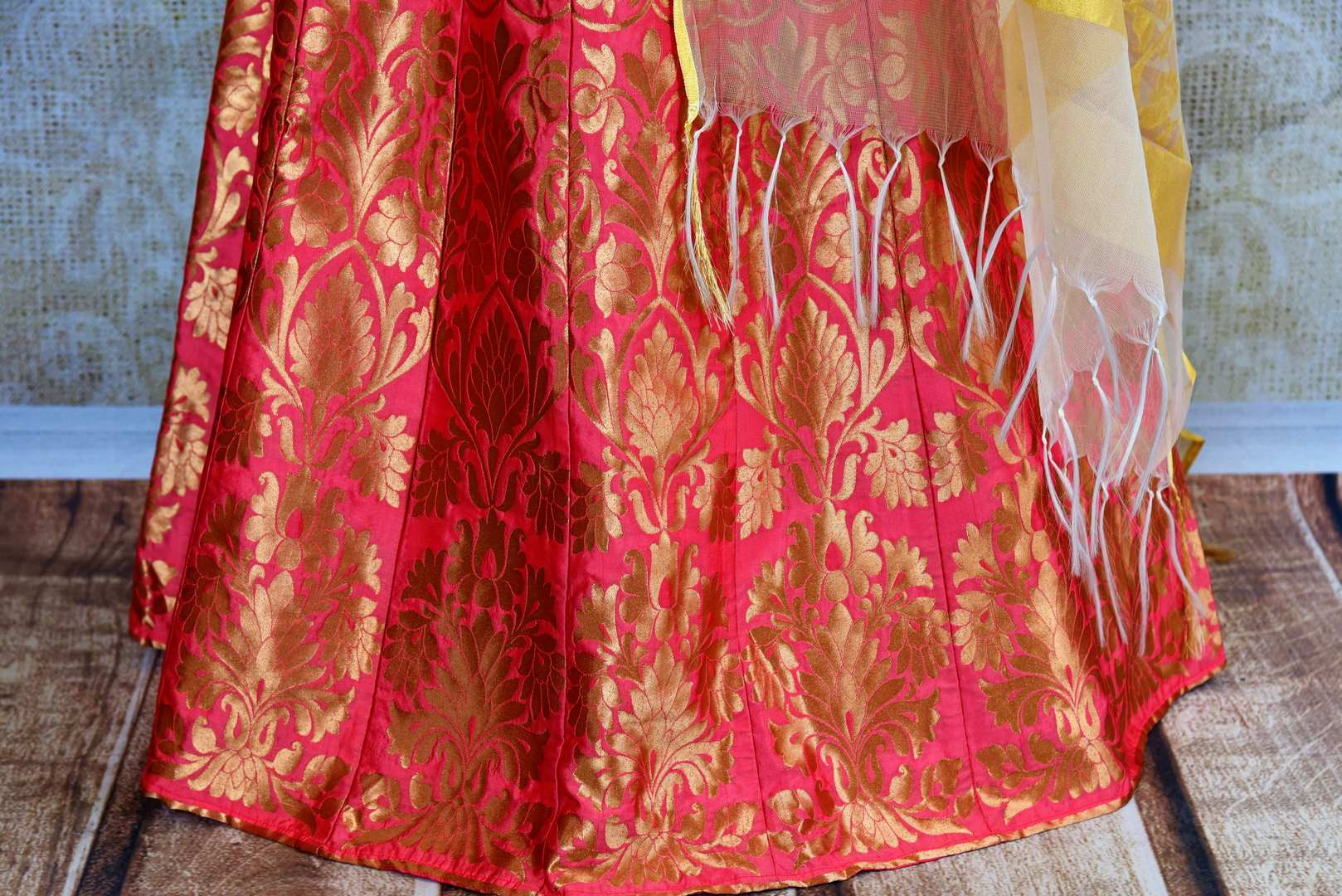 Buy yellow and pink silk lehenga online in usa with zardozi work. Pure Elegance fashion store brings an exquisite range of Indian designer lehengas in USA for women.-skirt