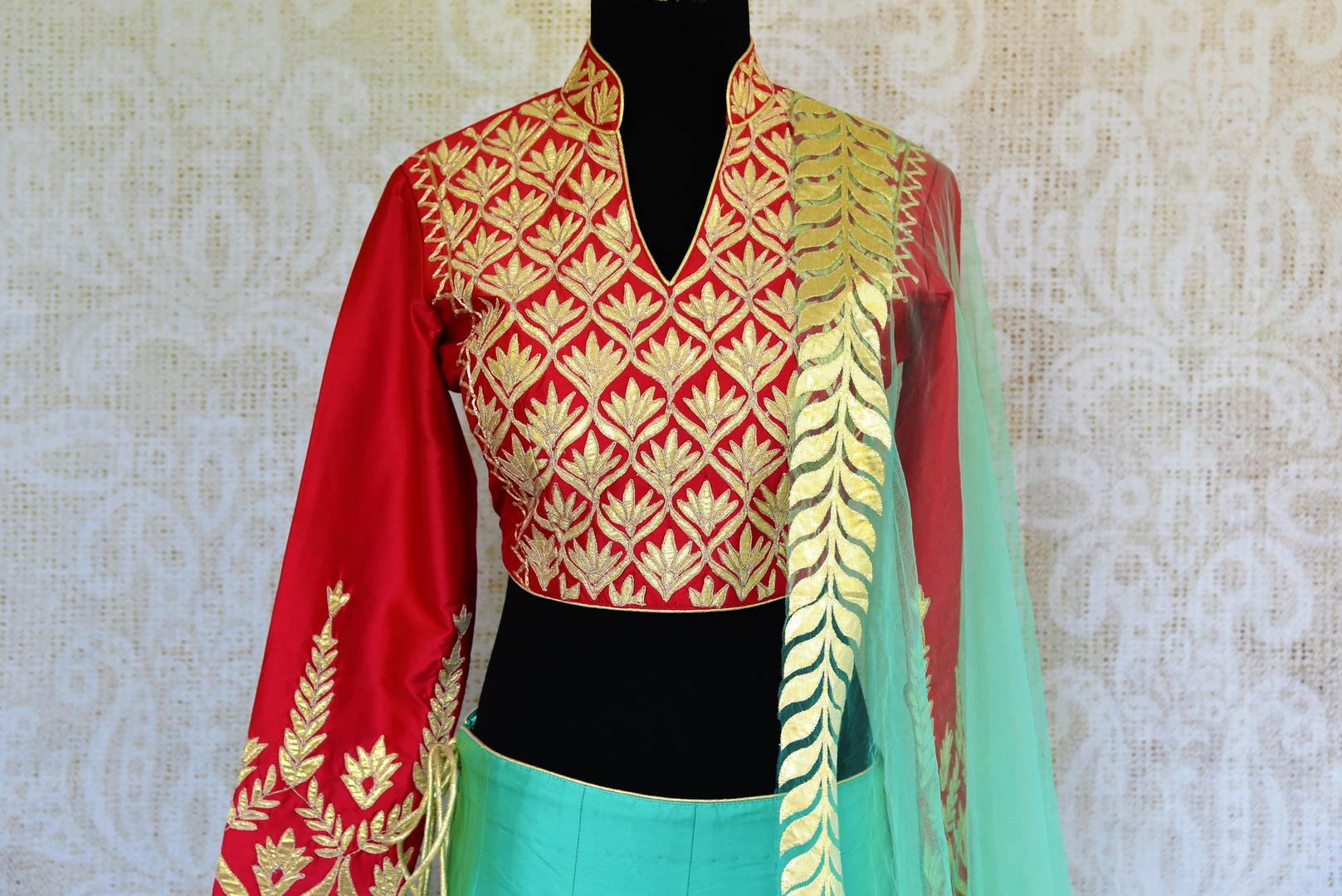 Buy red and green applique work silk lehenga online in USA. Pure Elegance fashion store brings a stunning range of Indian designer lehenga dresses in USA for weddings.-choli