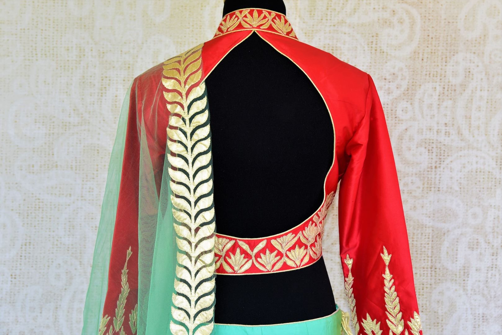 Buy red and green applique work silk lehenga online in USA. Pure Elegance fashion store brings a stunning range of Indian designer lehenga dresses in USA for weddings.-choli back