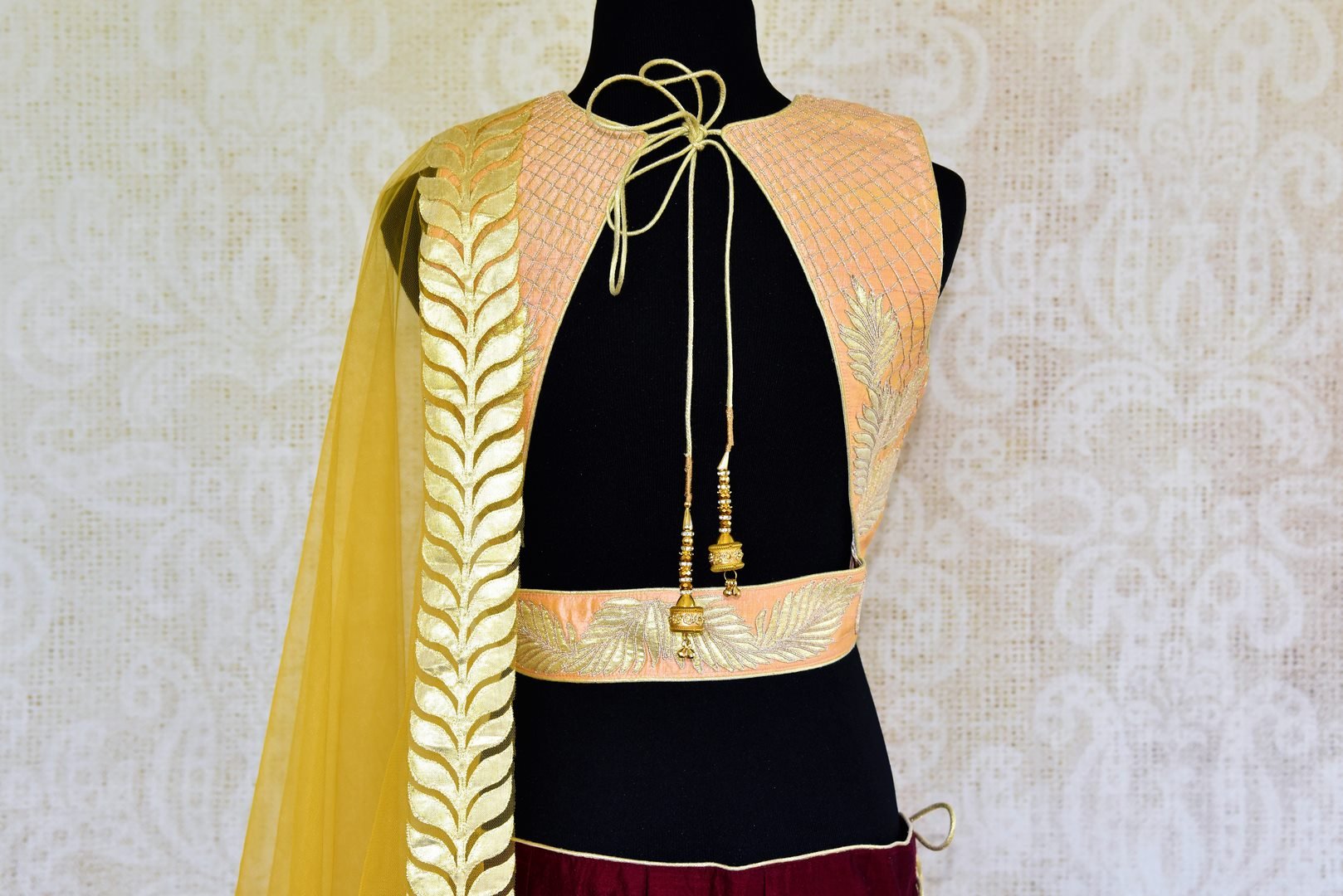 Buy peach and maroon applique work silk lehenga online in USA. Pure Elegance fashion store brings a stunning range of Indian designer lehenga in USA for weddings.-choli back