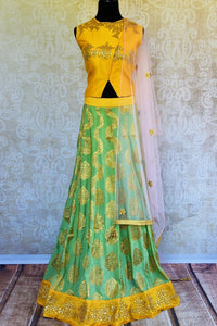 Buy yellow and green gota patti silk lehenga online in USA with dupatta. Pure Elegance fashion store brings a stunning range of Indian designer lehenga in USA for weddings.-full view