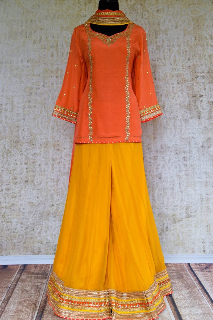 Buy peach gota patti kurti with embroidered yellow palazzo online at Pure Elegance. Our Indian fashion store brings exquisite range of designer dresses in USA.-full view