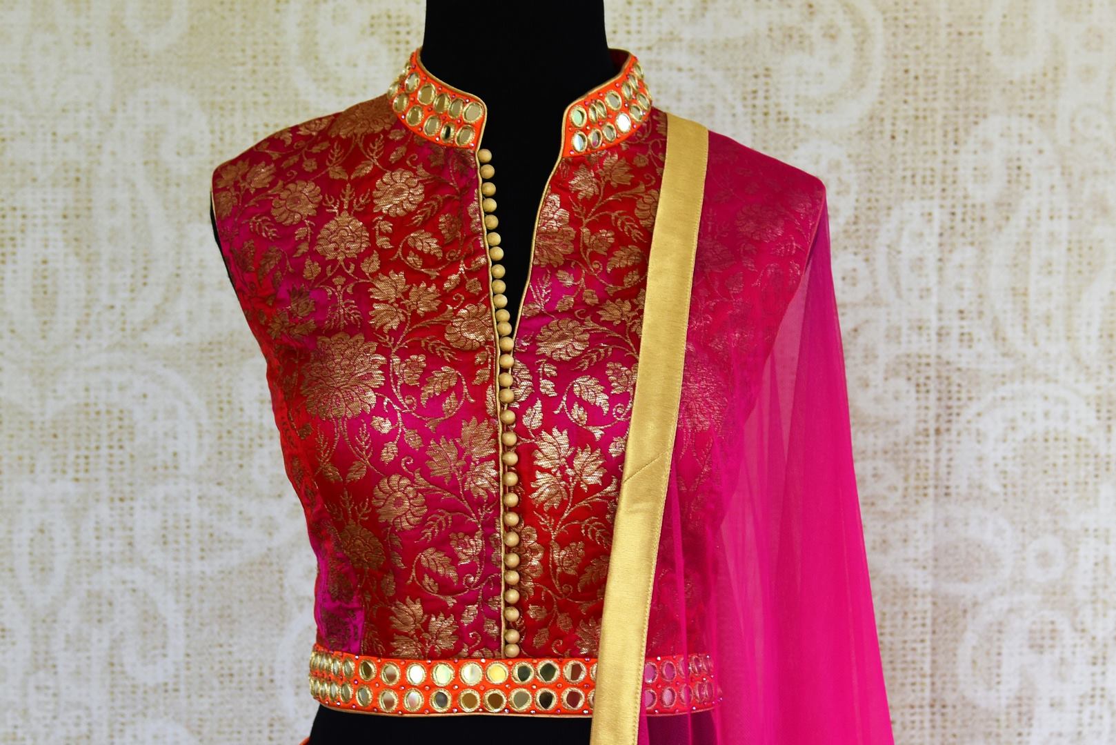 Buy pink mirror work Banarasi lehenga with dupatta online in USA. Pure Elegance clothing store brings an exquisite range of Indian designer lehengas in USA. Shop online.-blouse