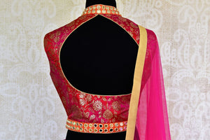 Buy pink mirror work Banarasi lehenga with dupatta online in USA. Pure Elegance clothing store brings an exquisite range of Indian designer lehengas in USA. Shop online.-blouse back