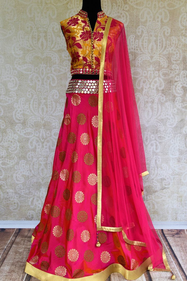 Buy bright pink mirror work Banarasi lehenga with dupatta online in USA. Pure Elegance clothing store brings an exquisite range of Indian designer dresses in USA. -full view
