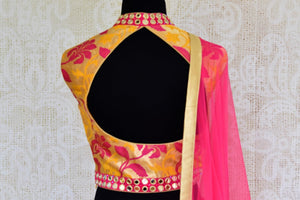 Buy bright pink mirror work Banarasi lehenga with dupatta online in USA. Pure Elegance clothing store brings an exquisite range of Indian designer dresses in USA. -blouse back