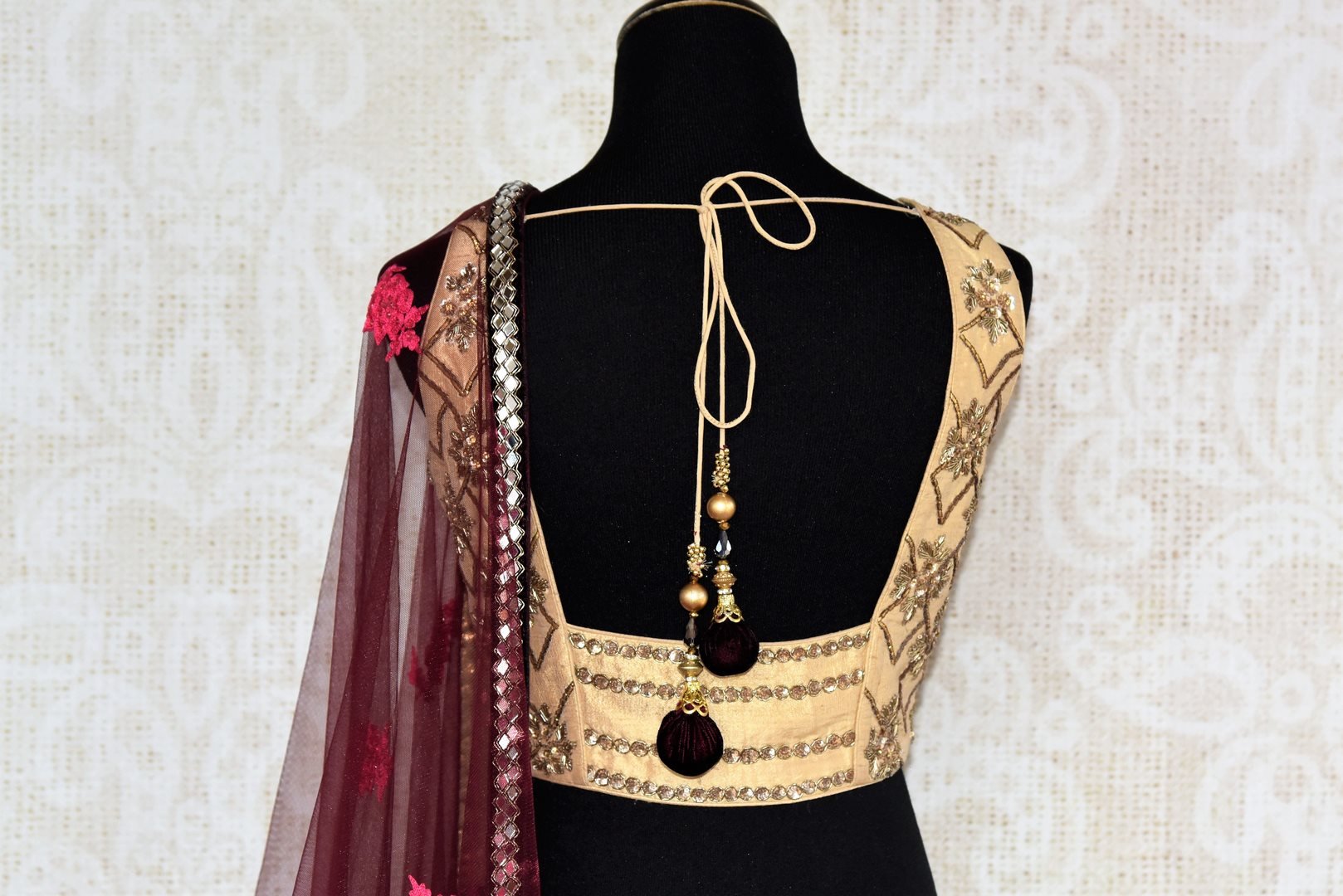 Buy purple embroidered velvet lehenga with dupatta online in USA . The designer lehenga is a captivating choice for weddings. Shop Indian wedding lehengas in USA from an alluring collection available at Pure Elegance clothing store.-back