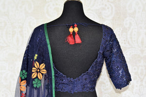 Amaze everyone as you step the aisle in this designer royal blue silk applique work lehenga with a floral blue dupatta. Channel the inner diva as you embrace the embroidered blouse and complete the look with utmost grace and poise. Shop designer Indian dress,Anarkali, lehengas online or visit Pure Elegance store, USA. -blouse back