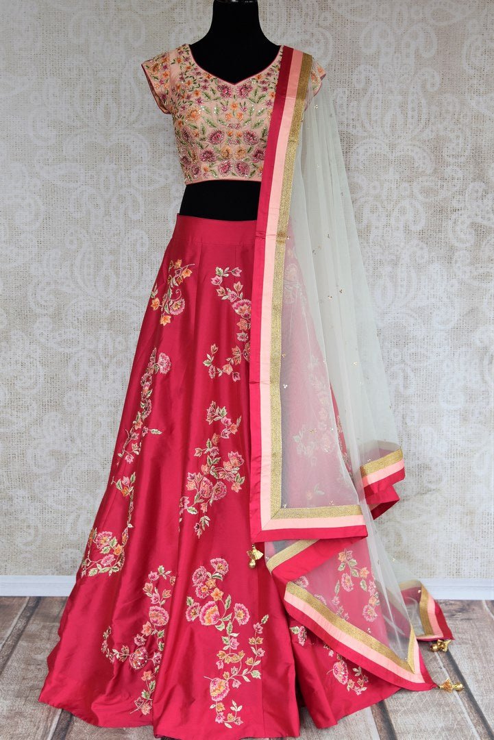 Buy beautiful pink embroidered silk lehenga with dupatta online in USA . The designer lehenga is a captivating choice for weddings. Shop Indian wedding lehengas in USA from an alluring collection available at Pure Elegance clothing store.-full view