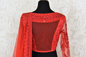 Buy red ticki work designer net lehenga with dupatta online in USA. Add brilliance to your Indian wedding look with an exquisite range of designer wedding lehengas available at Pure Elegance exclusive clothing store in USA or shop online.-blouse back