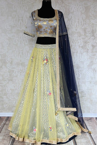 Buy yellow and grey embroidered Banarasi net lehenga with dupatta online in USA . The gorgeous lehenga is a captivating choice for weddings. Shop Indian designer lehengas in USA from an alluring collection available at Pure Elegance clothing store.-full view