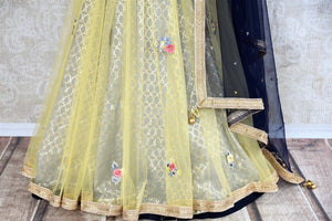 Buy yellow and grey embroidered Banarasi net lehenga with dupatta online in USA . The gorgeous lehenga is a captivating choice for weddings. Shop Indian designer lehengas in USA from an alluring collection available at Pure Elegance clothing store.-skirt