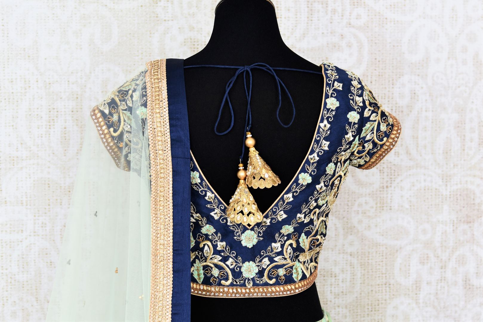 Buy pastel green and blue embroidered chanderi lehenga with dupatta online in USA. Add brilliance to your Indian wedding look with an exquisite range of designer wedding lehengas available at Pure Elegance exclusive clothing store in USA or shop online.-blouse back