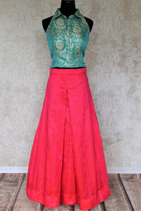 Embrace the beauty of indo-western dresses with our exclusively designed green banarsi silk blouse and pink silk palazzo skirt. Don this uber-fashionable ensemble at events and parties to unleash the diva in you. Shop designer dresses, trendy lehengas, handloom sarees online or visit Pure Elegance store in USA. -full view