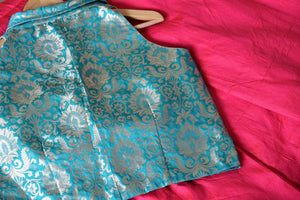 Embrace the beauty of indo-western dresses with our exclusively designed green banarsi silk blouse and pink silk palazzo skirt. Don this uber-fashionable ensemble at events and parties to unleash the diva in you. Shop designer dresses, trendy lehengas, handloom sarees online or visit Pure Elegance store in USA. -details