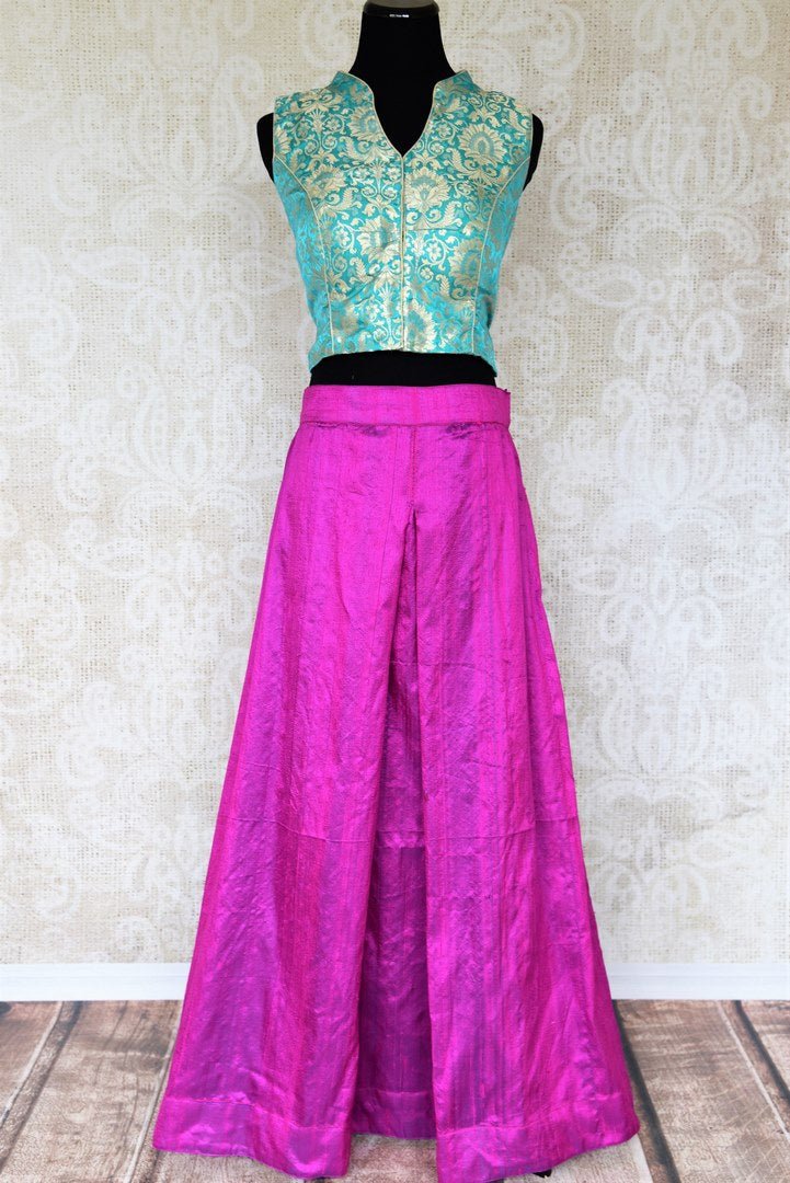 Dreamy hues perfectly captured in this vibrant purple pure silk palazzo skirt to exude the contemporary feels. The handcrafted sea green banarsi silk blouse brings out the traditional element of this Indo-western dress. Shop trendy Indian dresses, fashionable lehenga skirts and blouses online or visit Pure Elegance store in USA. -full view