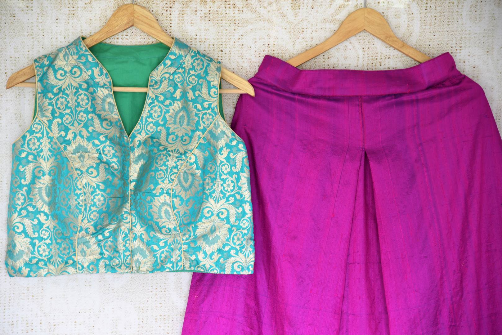Dreamy hues perfectly captured in this vibrant purple pure silk palazzo skirt to exude the contemporary feels. The handcrafted sea green banarsi silk blouse brings out the traditional element of this Indo-western dress. Shop trendy Indian dresses, fashionable lehenga skirts and blouses online or visit Pure Elegance store in USA. -details