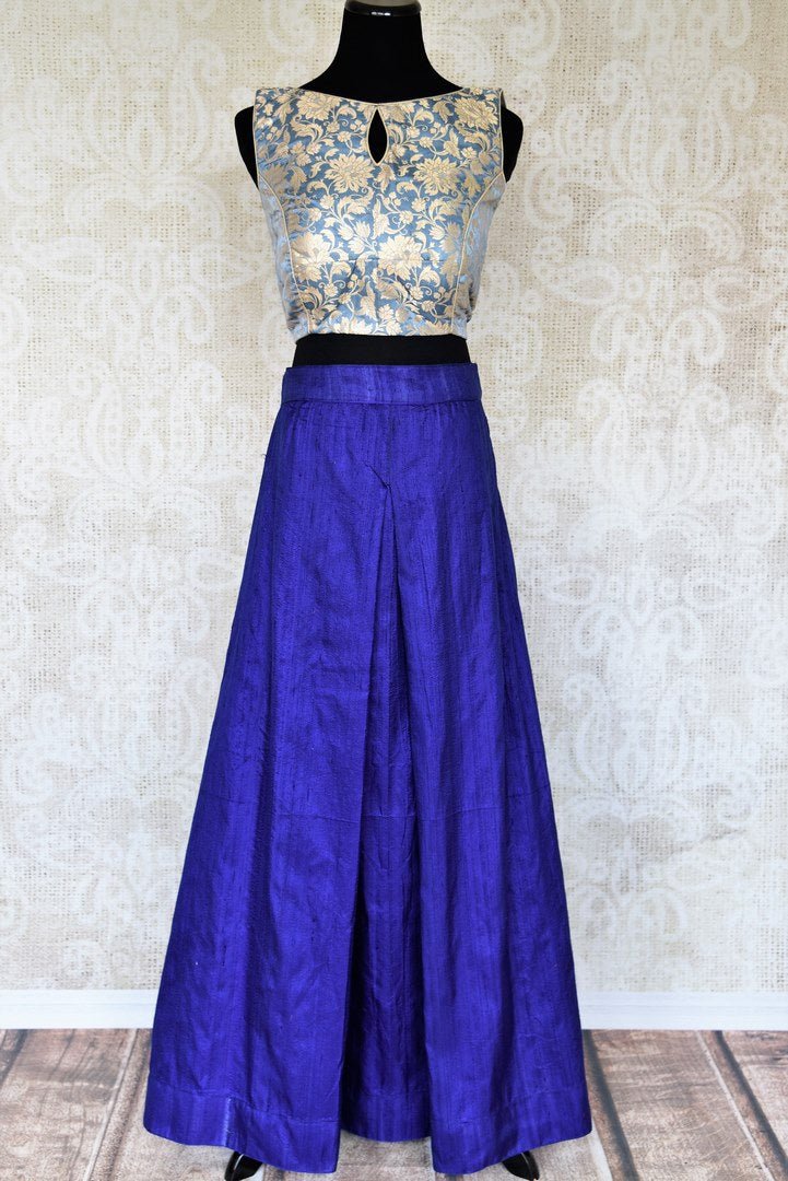 Up your ante in this designer blue raw silk palazzo skirt tailored with light blue banarsi silk blouse to add a punch of drama and ethnicity to the overall look. This indo-western dress is perfect for special events. Shop Indian dresses, designer sarees, lehenga skirts online or visit Pure Elegance store in USA. -full view