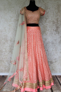 Look no less than a princess in this dreamy soft pink chanderi silk lehenga complemented with a pink zardozi embroidered blouse. A sheer net white embroidered dupatta to complete the look delicately falls on a side. Shop Indian dresses, lehenga choli, anarkali suit online or visit Pure Elegance store, USA.-full view