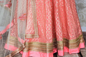 Look no less than a princess in this dreamy soft pink chanderi silk lehenga complemented with a pink zardozi embroidered blouse. A sheer net white embroidered dupatta to complete the look delicately falls on a side. Shop Indian dresses, lehenga choli, anarkali suit online or visit Pure Elegance store, USA.-lehenga
