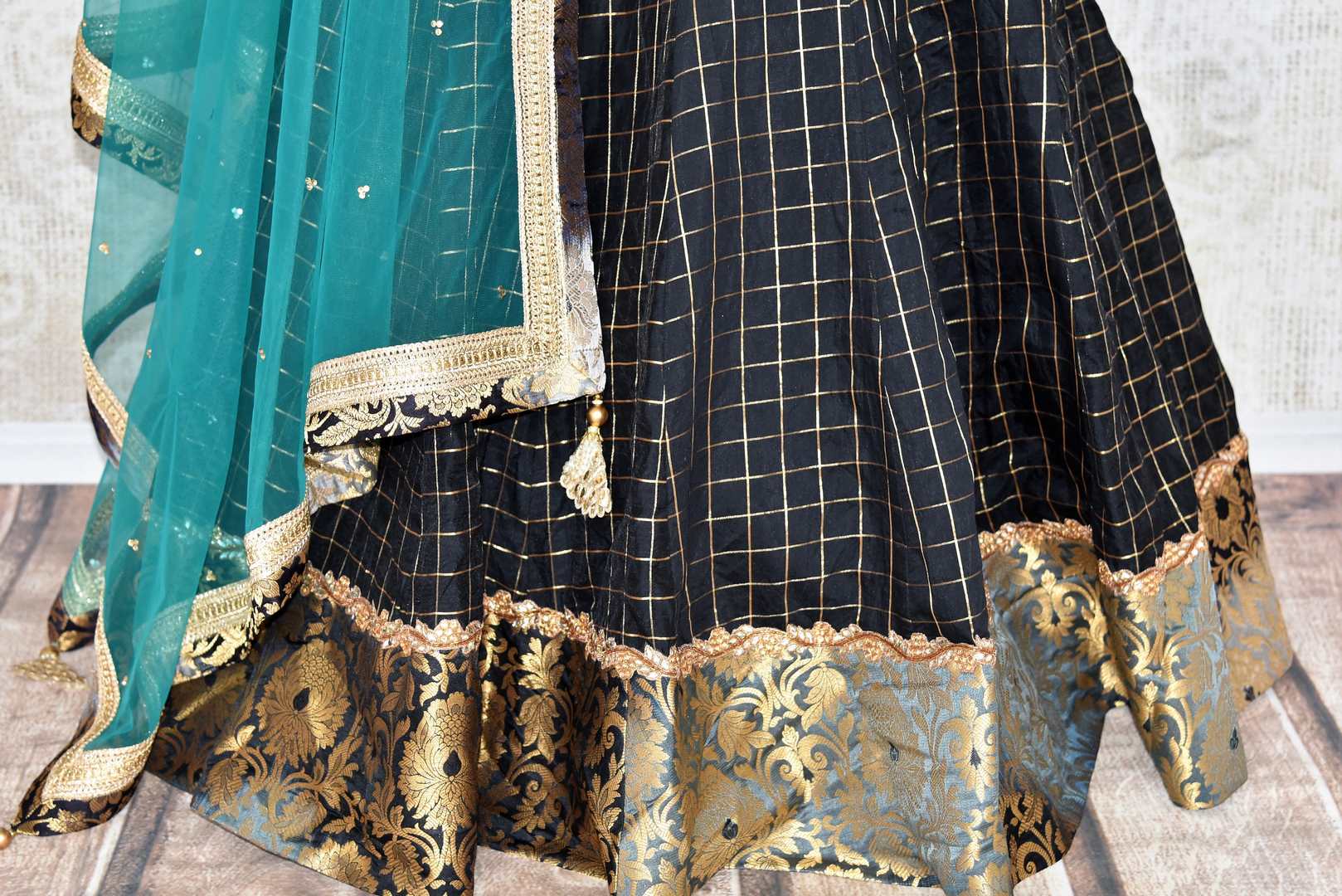Heavily ornamented royal blue silk lehenga with checkered details and banarsi border comes with a gorgeous blue and beige silk embroidered blouse. Let the teal sequinned net dupatta fall immaculately for the feminine look. Shop designer sarees, lehenga cholis, Indian dresses online or visit Pure Elegance store, USA. -lehenga skirt