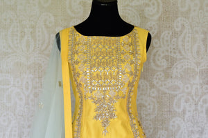 Wedding season calls for some serious indulgence and this mint green moti embroidery lehenga will not fail you. It comes with a bright yellow embroidered kurti. Drape the fancy mint green net dupatta on the side. Shop Indian dresses, anarkali suits, lehenga online or visit Pure Elegance store, USA. -kurta front