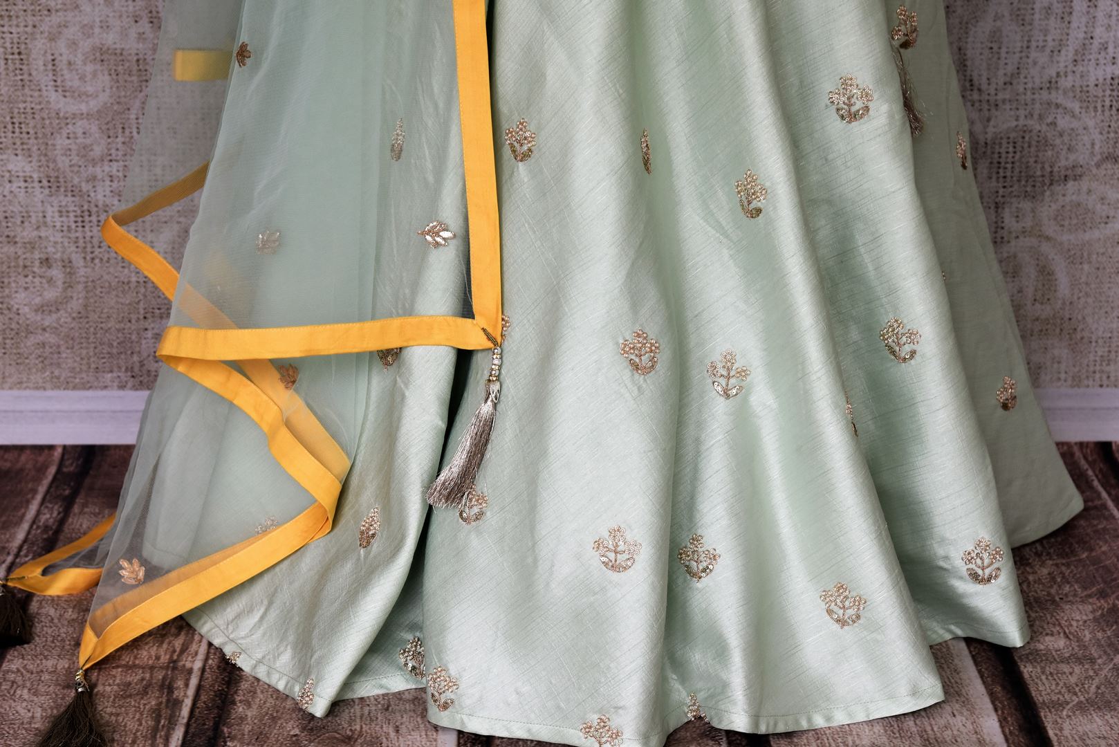 Wedding season calls for some serious indulgence and this mint green moti embroidery lehenga will not fail you. It comes with a bright yellow embroidered kurti. Drape the fancy mint green net dupatta on the side. Shop Indian dresses, anarkali suits, lehenga online or visit Pure Elegance store, USA. -lehenga skirt