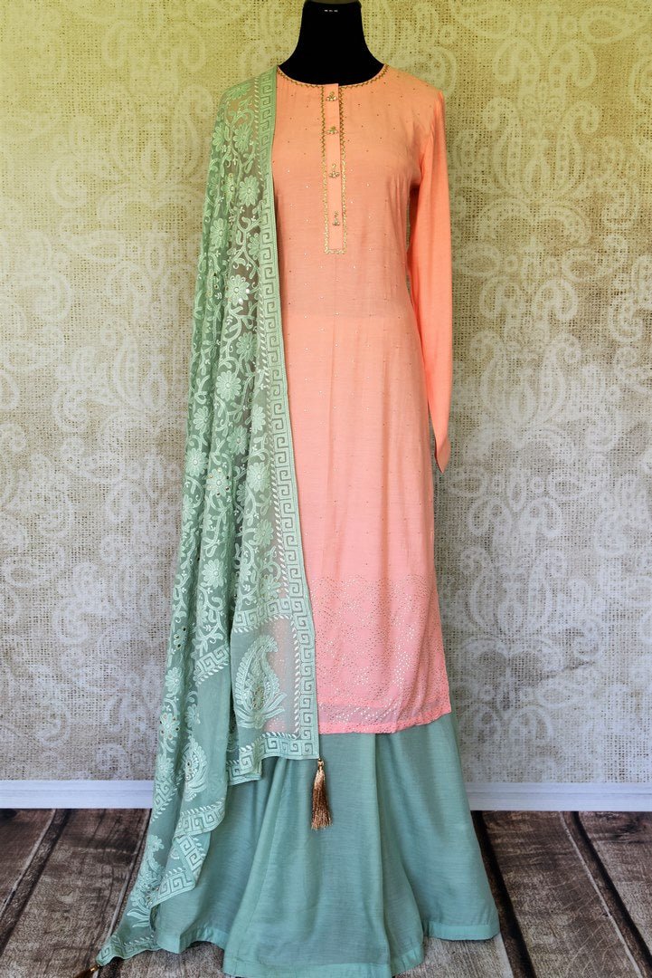 Sashay like a queen in this delicately handcrafted pink chanderi silk long kurta. The sequin work laden kurta is paired well with contrasting mint green skirt and chikankari dupatta to unveil the elegant you. Shop such designer silk sarees, anarkali suits, lehenga sets online or visit Pure Elegance store, USA.-full view