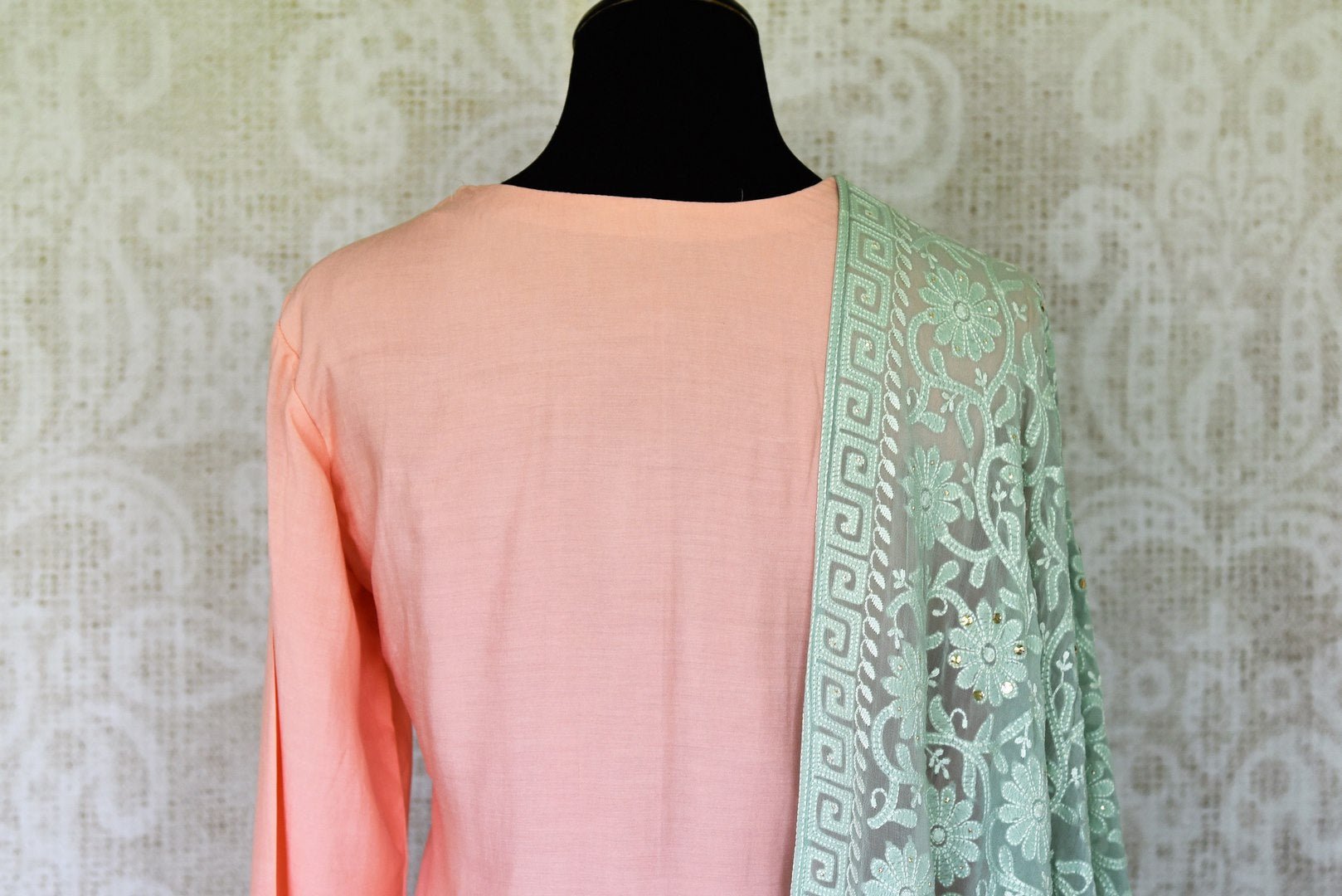 Sashay like a queen in this delicately handcrafted pink chanderi silk long kurta. The sequin work laden kurta is paired well with contrasting mint green skirt and chikankari dupatta to unveil the elegant you. Shop such designer silk sarees, anarkali suits, lehenga sets online or visit Pure Elegance store, USA.-kurta back