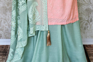 Sashay like a queen in this delicately handcrafted pink chanderi silk long kurta. The sequin work laden kurta is paired well with contrasting mint green skirt and chikankari dupatta to unveil the elegant you. Shop such designer silk sarees, anarkali suits, lehenga sets online or visit Pure Elegance store, USA.-skirt