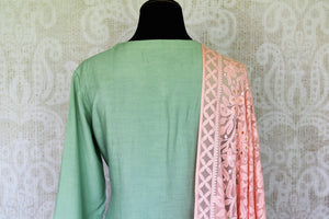 Ooze an oomph in this mint green chanderi silk sequin work long kurta. The beautifully handcrafted kurta is styled with contrasting pink flowy silk skirt. Drape the pleasing pink chikankari dupatta to complete the look. Shop designer suits, lehenga sets, Indian dresses online or visit Pure Elegance store,USA. -kurta back