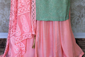 Ooze an oomph in this mint green chanderi silk sequin work long kurta. The beautifully handcrafted kurta is styled with contrasting pink flowy silk skirt. Drape the pleasing pink chikankari dupatta to complete the look. Shop designer suits, lehenga sets, Indian dresses online or visit Pure Elegance store,USA. -skirt