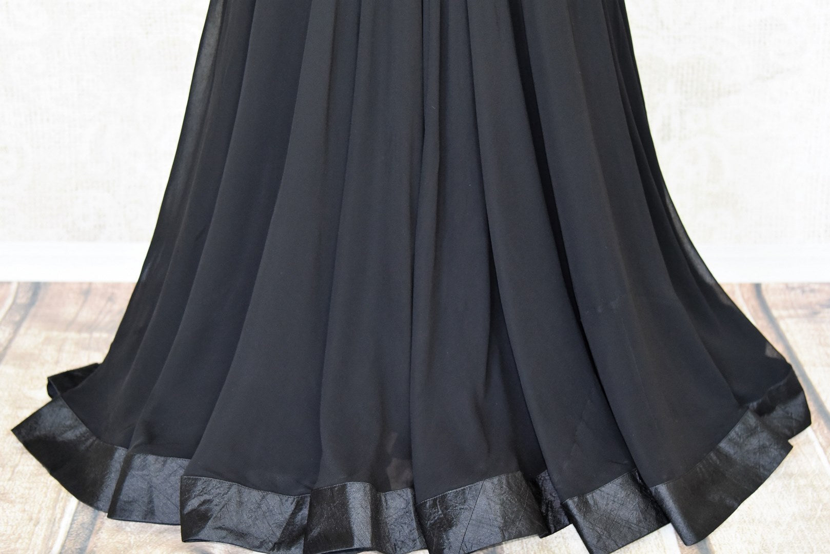 This jaw-dropping black raw silk floor-length skirt is a versatile piece for your wardrobe. Style it right with a hand embroidered floral designer monochrome blouse. Shop designer anarkali suits, kurta sets, lehenga sets online or visit Pure Elegance store, USA. -skirt
