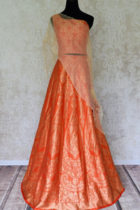 Shop orange Banarasi lehenga online in USA with organza overlay choli. Make every occasion special by choosing the best of designer dresses from Pure Elegance Indian clothing store in USA, Shop from a range of stunning designer lehengas, wedding dresses, Indowestern dresses from our online store.-full view