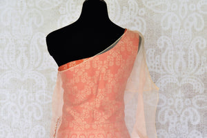 Shop orange Banarasi lehenga online in USA with organza overlay choli. Make every occasion special by choosing the best of designer dresses from Pure Elegance Indian clothing store in USA, Shop from a range of stunning designer lehengas, wedding dresses, Indowestern dresses from our online store.-blouse back