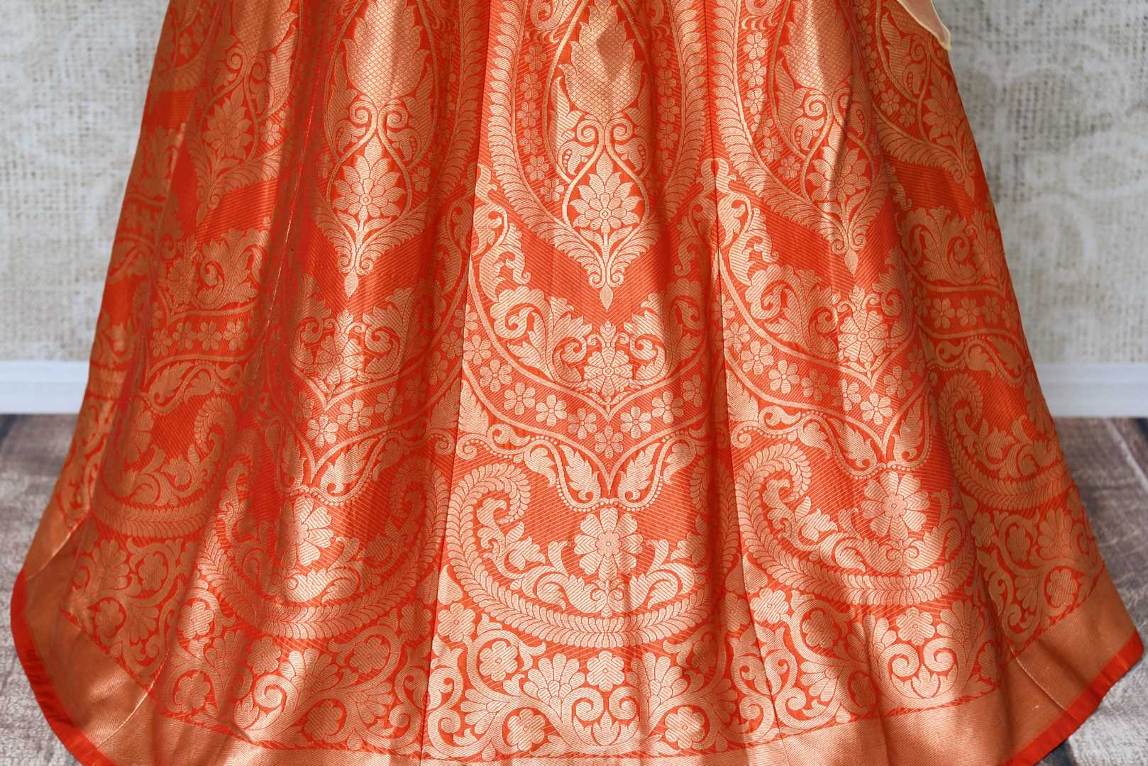 Shop orange Banarasi lehenga online in USA with organza overlay choli. Make every occasion special by choosing the best of designer dresses from Pure Elegance Indian clothing store in USA, Shop from a range of stunning designer lehengas, wedding dresses, Indowestern dresses from our online store.-lehenga