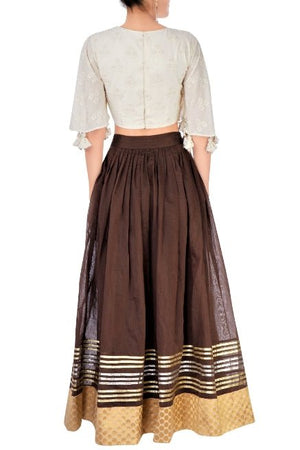 Buy brown chanderi lehenga with off-white embroidered crop top online in USA. Stand amongst the crowd with an exclusive range of Indian dresses, designer lehengas from Pure Elegance Indian fashion store in USA or shop online.-back