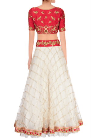 Buy off-white embroidered tule lehenga online in USA with raw silk red choli. Stand amongst the crowd with an exclusive range of Indian dresses, designer lehengas, Indowestern dresses from Pure Elegance Indian fashion store in USA or shop online.-back