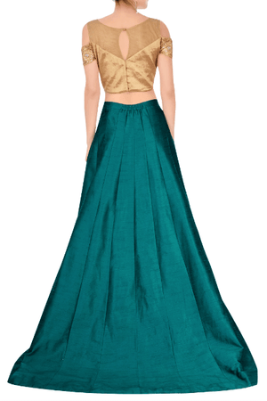 Shop green train lehenga with embroidered cold shoulder blouse online in USA. Grab those eyeballs at special occasions with an exclusive range of Indian dresses, designer lehengas from Pure Elegance Indian fashion store in USA or shop online.-back