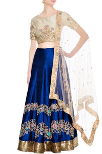 Buy royal blue embroidered lehenga online in USA with beige blouse. Give a touch of elegance to your style with an exclusive range of Indian dresses, designer lehengas from Pure Elegance Indian fashion store in USA or shop online.-full view