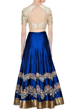 Buy royal blue embroidered lehenga online in USA with beige blouse. Give a touch of elegance to your style with an exclusive range of Indian dresses, designer lehengas from Pure Elegance Indian fashion store in USA or shop online.-back