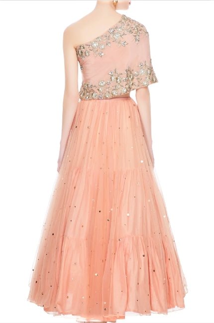 Buy peach net layered lehenga online in USA with embroidered one shoulder blouse. Add a flavor of glamor with an exclusive range of Indian formal dresses, designer lehengas, Indowestern dresses from Pure Elegance Indian fashion store in USA or shop online.-back