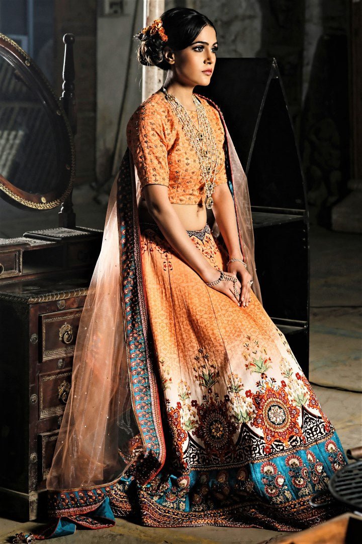 Buy beautiful peach gota patti embroidery lehenga online in USA with digital print. Bring a rich traditional touch to your bridal look with beautiful Indian designer lehengas from Pure Elegance clothing store. We have a range of wedding lehengas, designer sarees, bridal saris in USA online and in our store. Shop now. -full view