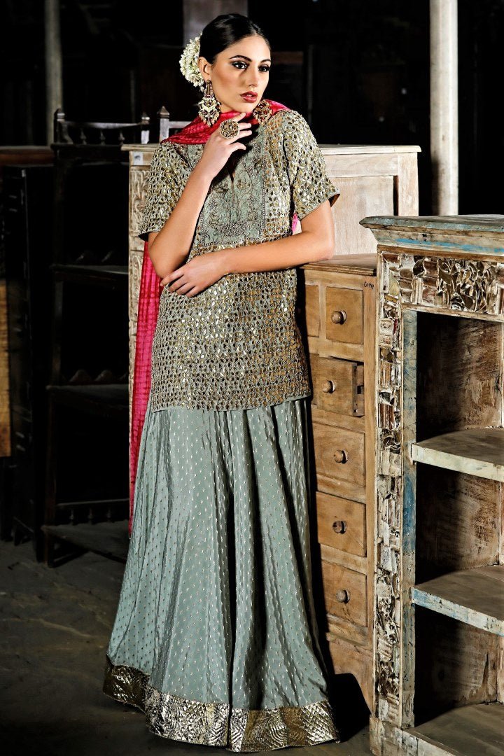 Buy sage green gota patti embroidery kurta with skirt online in USA with silk tie-dye dupatta. Bring a rich traditional touch to your ethnic look with beautiful Indian designer lehengas from Pure Elegance clothing store. We have a range of wedding lehengas, designer sarees, bridal saris in USA online and in our store. Shop now. -full view