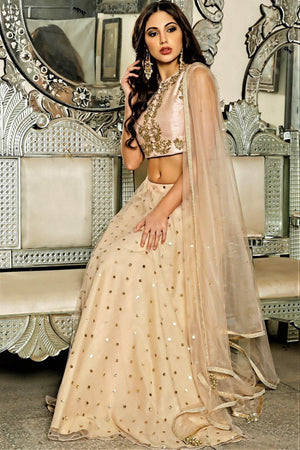 Buy pink raw silk crop top with net skirt online in USA with net dupatta. Bring a rich traditional touch to your ethnic look with beautiful Indian designer lehengas from Pure Elegance clothing store. We have a range of wedding lehengas, designer sarees, bridal saris in USA online and in our store. Shop now. -side view