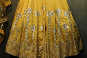 Buy yellow gota patti lehenga with choli online in USA. It comes with a matching dupatta. Find more such exquisite designer lehengas at Pure Elegance online store. You can also give us a visit at our exclusive Indian fashion store in USA and shop from a range of beautiful Indian lehengas, wedding dresses, Anarkalis and much more.-lehenga